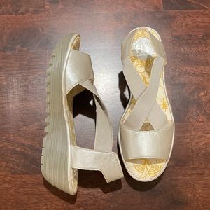 Fly London Yaji Silver Cross Wedge Sandals $198